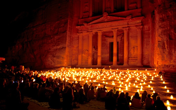 The temples of Petra in Jordan lit up by candles at night
