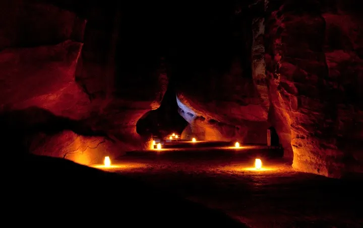 Candlelit pathway through Petra at night