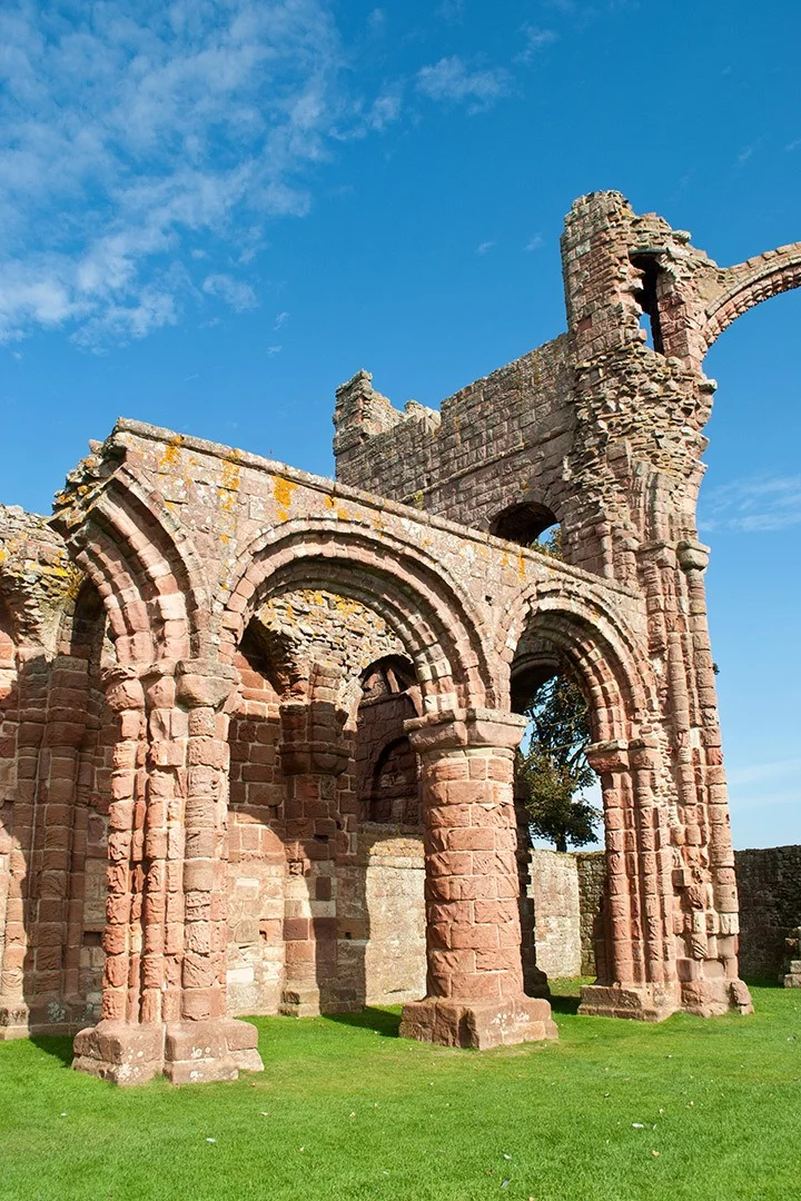 Among the ruins at one of Northumberland's most important religious sites – Lindisfarne Priory on Holy Island, attracting pilgrims for almost 1400 years.