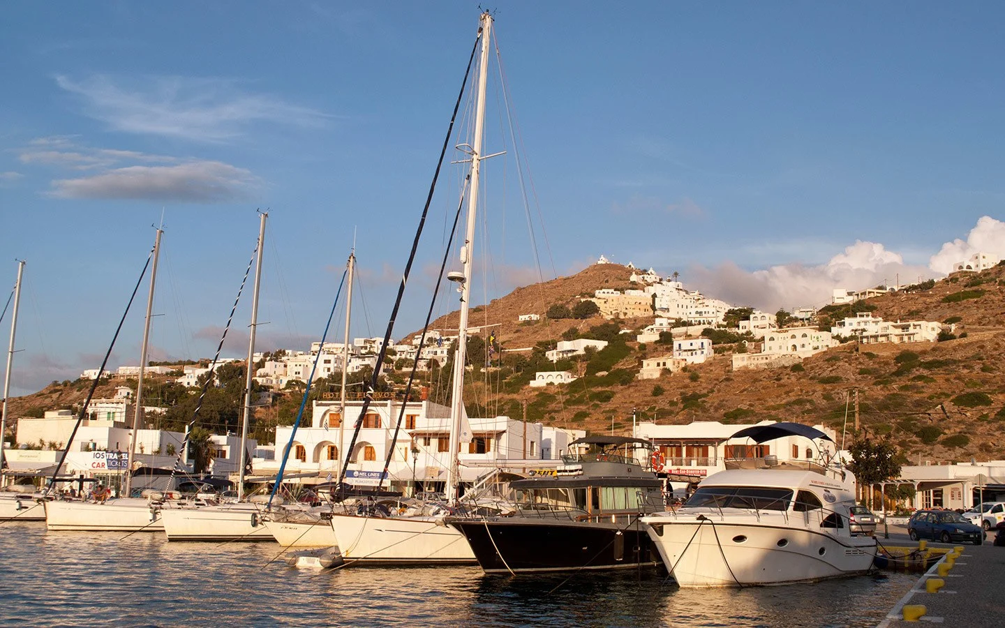 Boats in the harbour in Ios at sunset