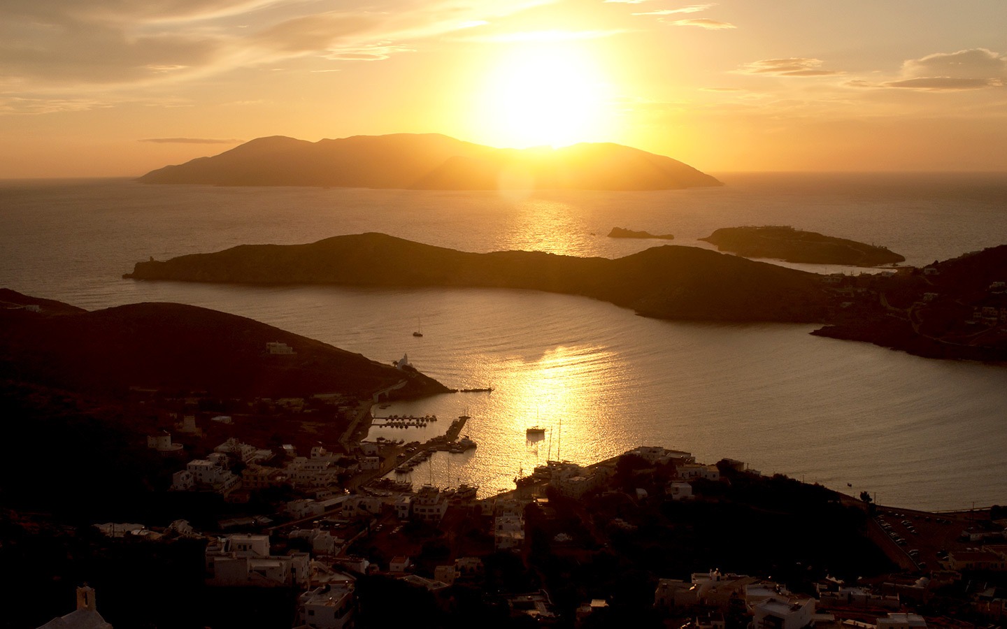 Sunset over the island of Sikinos from Ios in Greece