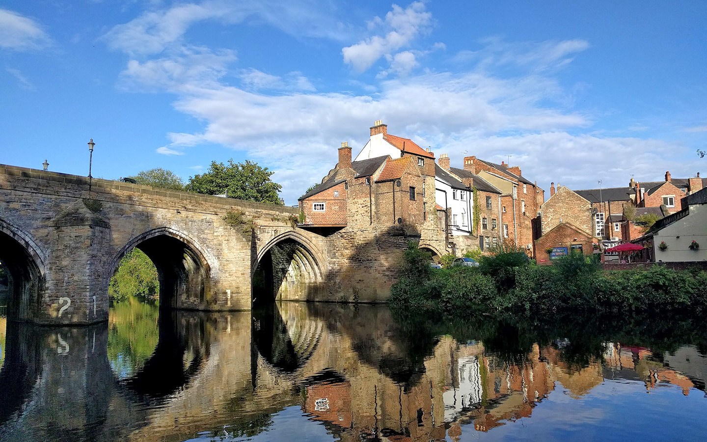 Bridge and buildings on the riverside in Durham, an alternative to visiting Oxford