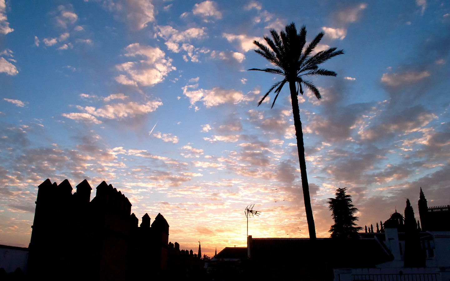 Sunset over the roof of the Alcazar in Seville in winter