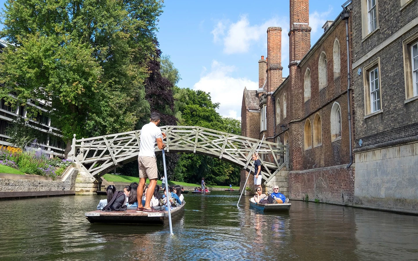 Punting past the Mathematical Bridge in Cambridge