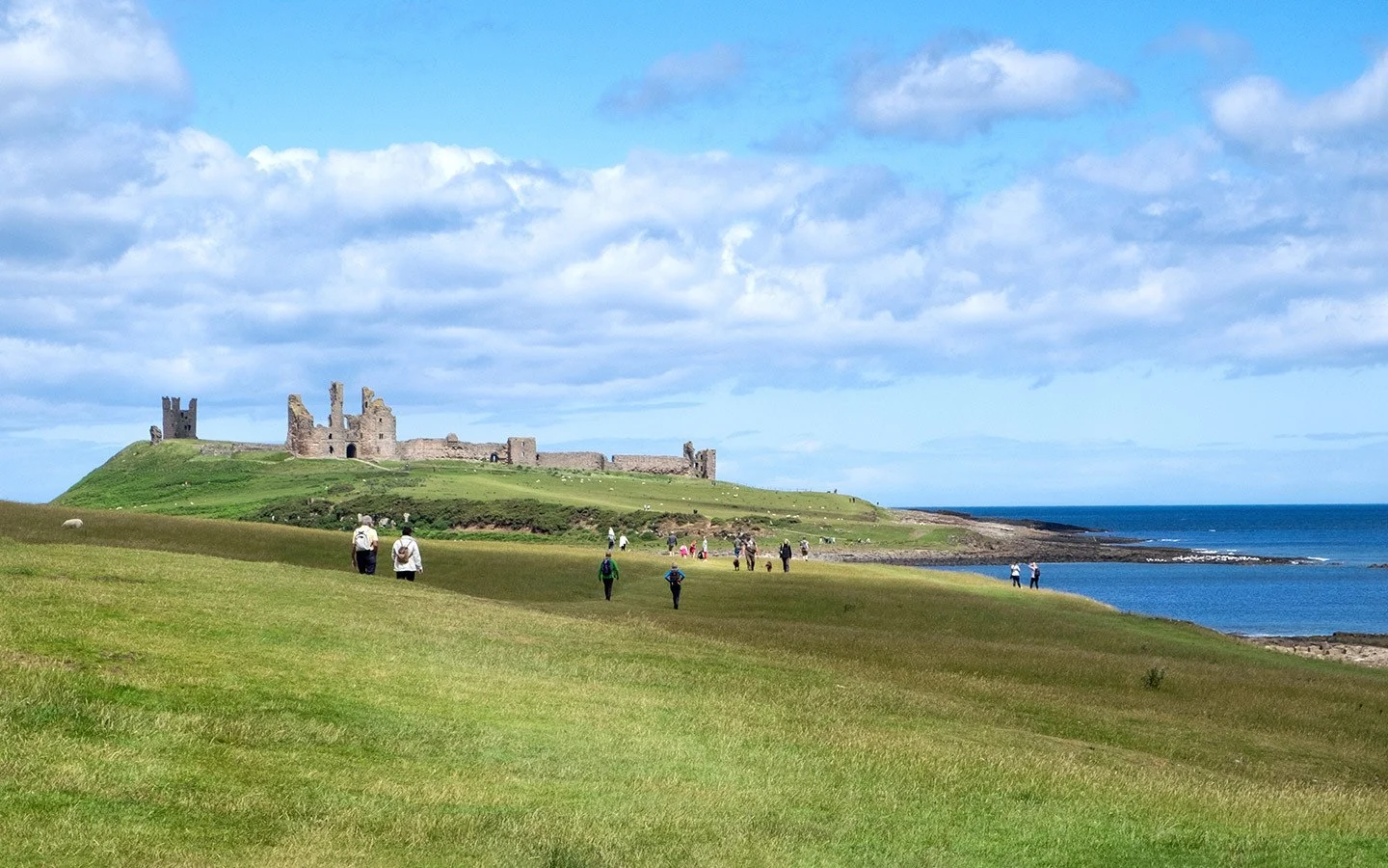 Dunstanburgh Castle on a UK walking holiday along the Northumberland Coast Path