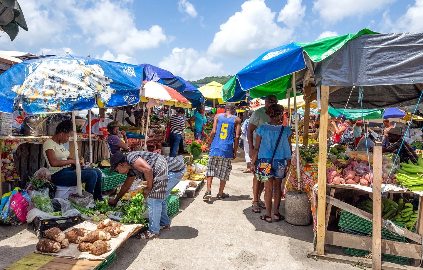 Shopping locally at Castries market in Saint Lucia, one of the ways to travel more sustainably