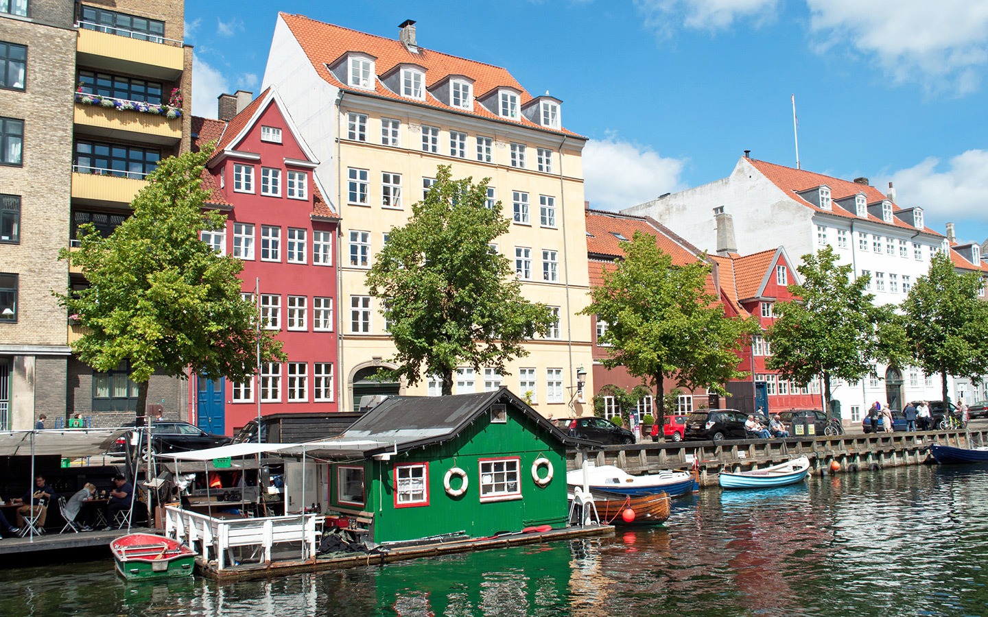 Boats and colourful buildings by he canal in Christianshavn in Copenhagen