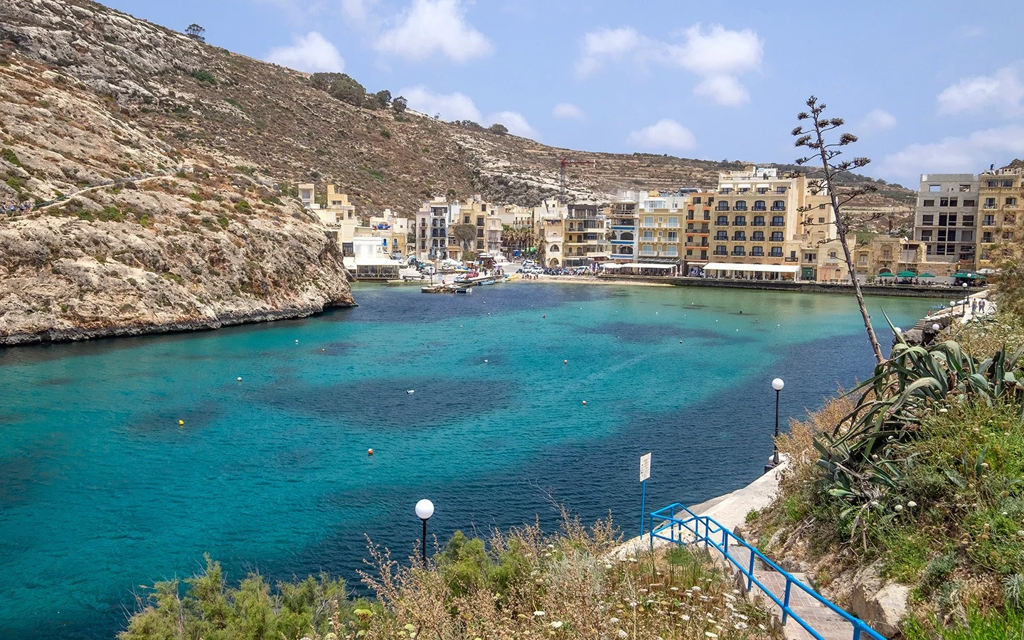 The blue waters of Xlendi Bay in Gozo, Malta