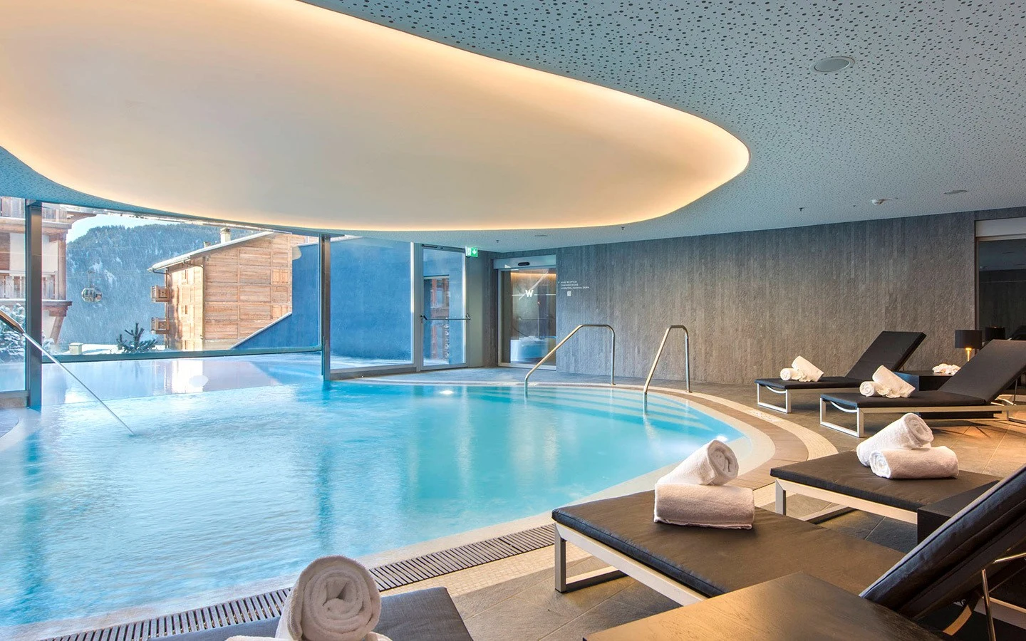 Indoor/outdoor swimming pool and spa at the W Verbier hotel