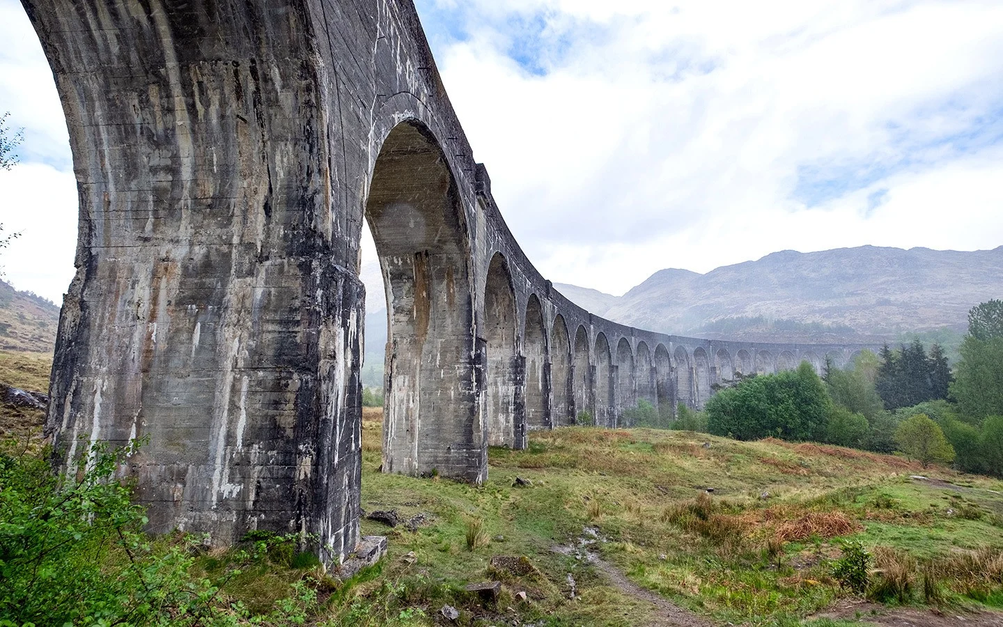 The Jacobite steam train crosses the Glenfinnan Viaduct