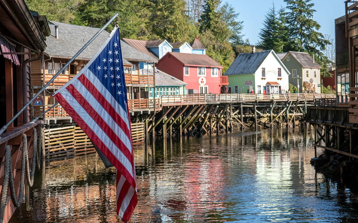 US flag flying along the waterfront in Ketchikan Creek Street