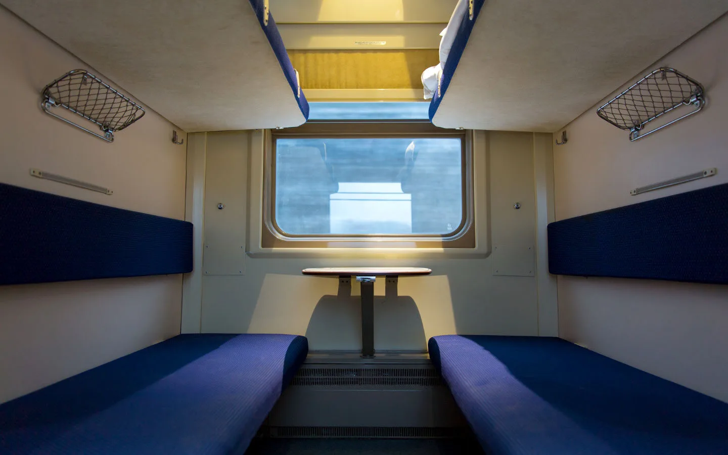A four-bed couchette on a European sleeper train