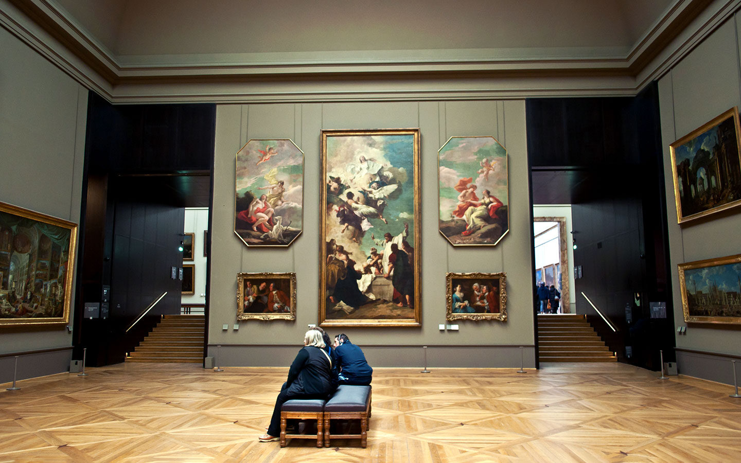 Admiring artworks in the Louvre gallery in Paris
