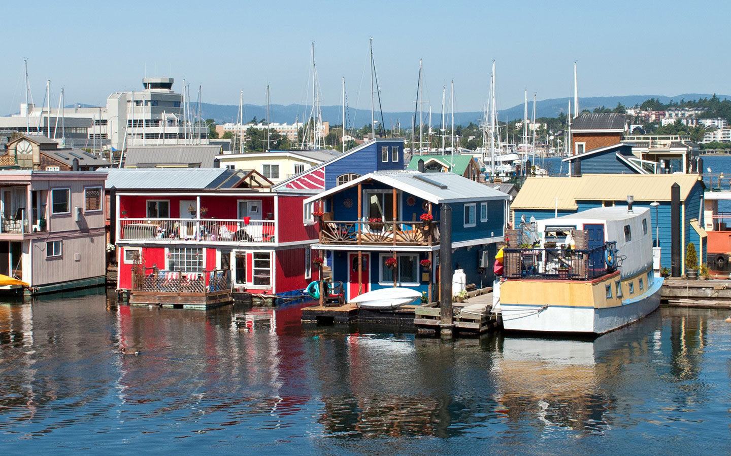 Colourful floating houses in Fisherman's Wharf in Victoria