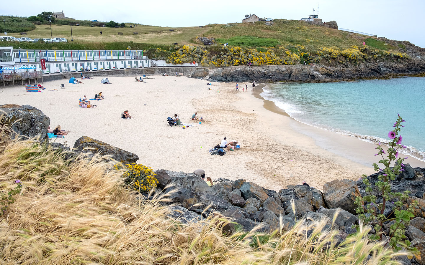 Porthgwidden Beach with beach chalets in St Ives, Cornwall