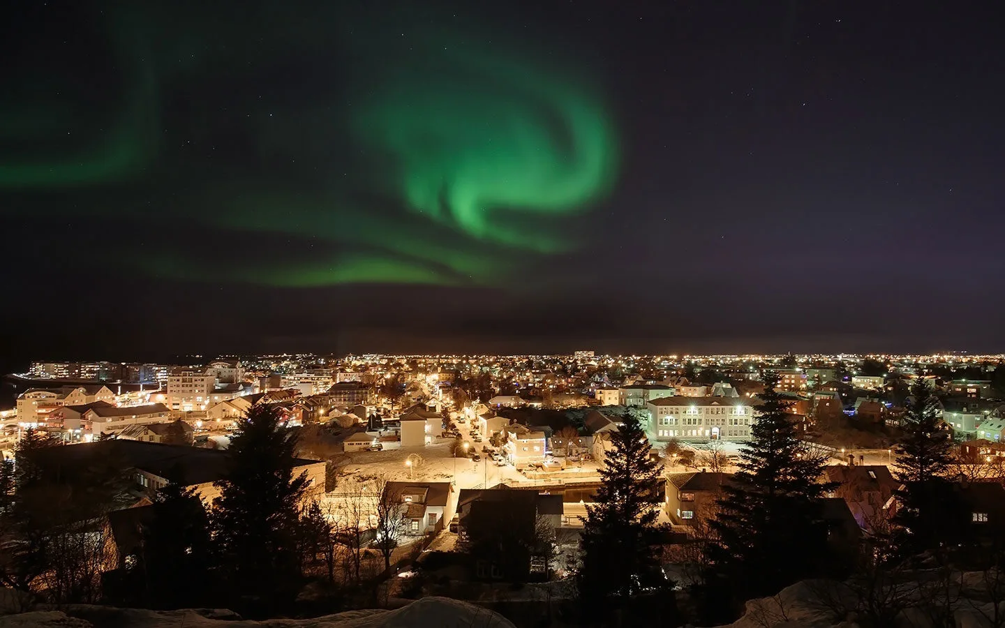 The Northern Lights over Reykjavik in winter
