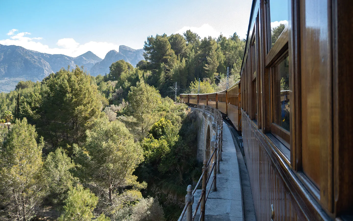 The train from Palma to Soller crossing the viaduct over the Torrent dels Montreals