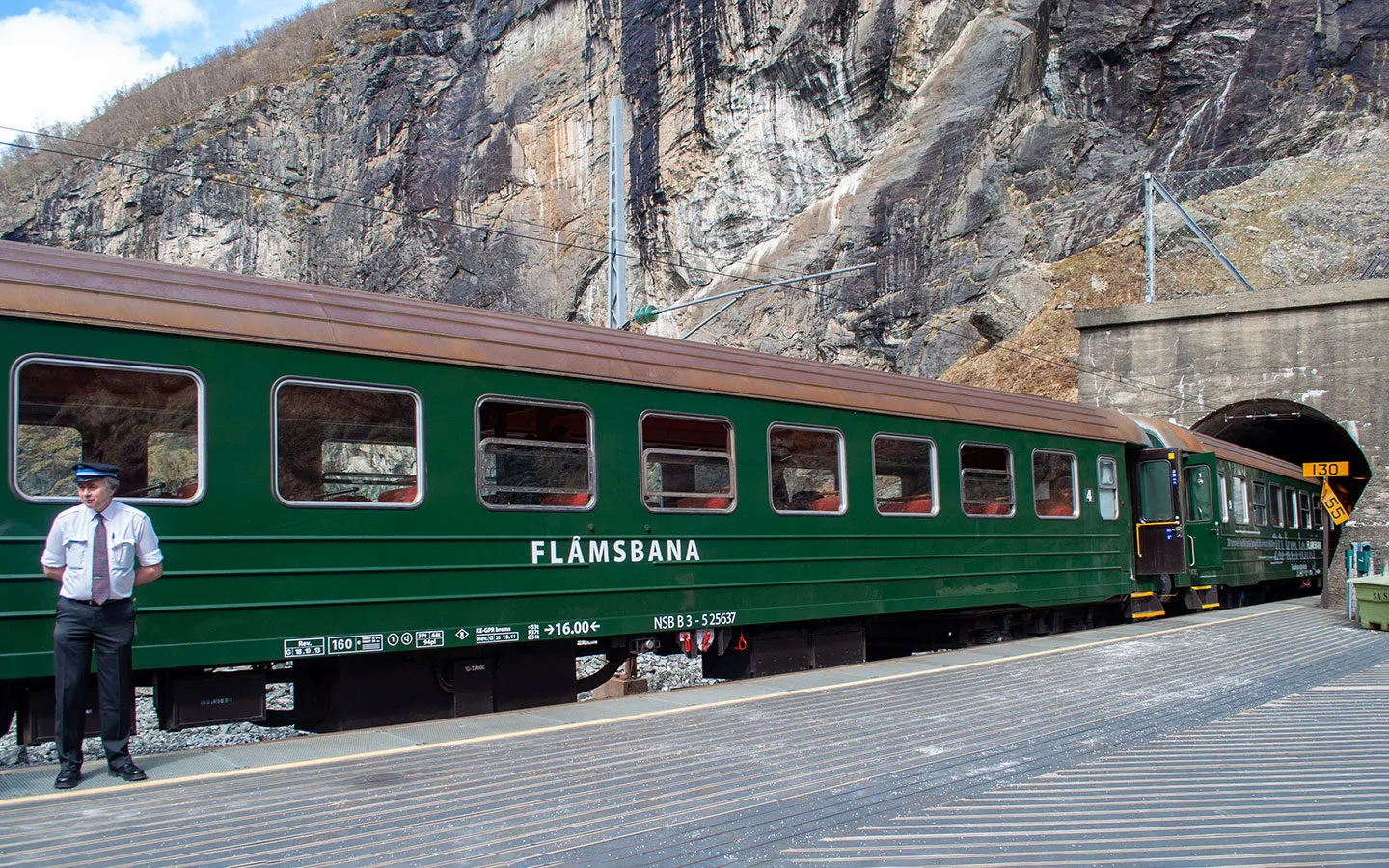 Train waiting by a tunnel on the Flam Railway route