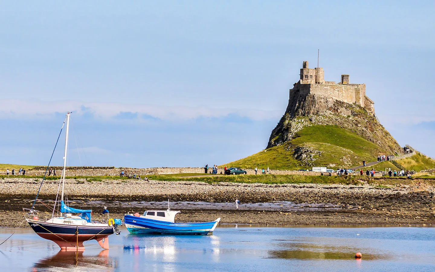 Boats in front of Lindisfarne Castle